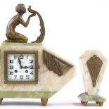 A French Art Deco alabaster and onyx-cased clock garniture, surmounted by a gilt-metal figure of a