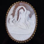 A relief carved cameo panel brooch, depicting Classical maiden and boy, in 9ct gold twist frame,