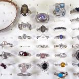 Various silver stone set rings, together with a rose gilt-silver stone set bangle