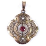 An unmarked gold garnet and split-pearl pendant, openwork stylised settings, height excluding bale