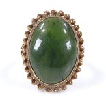 A 9ct gold oval green stone dress ring, with rope twist surround, setting height 22.8mm, size J, 4.