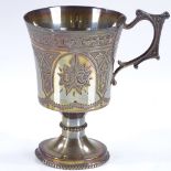 A Victorian silver mug, with engraved floral decoration and cast-silver handle, with bead-edge foot,