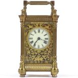 An ornate French brass-cased carriage clock with fretwork decoration, 8-day movement, case height