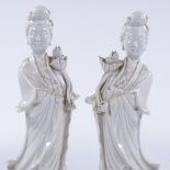 A pair of Chinese Blanc de Chine porcelain figures of women, height 38cm