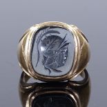 A large 9ct gold carved intaglio haematite seal ring, depicting Centurion, setting height 18.7mm,