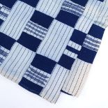 A Ghanian blue and white embroidered geometric design bed cover