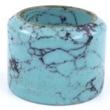 A polished turquoise archer's ring, diameter 32cm
