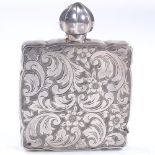 A small square sterling silver perfume bottle, with all over engraved foliate and floral body, and