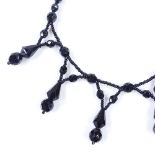 A Victorian faceted jet festoon necklace, length 39cm