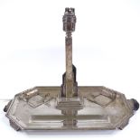 A large Art Deco octagonal silver desk stand, with central stepped lamp, opposing inkwell bases