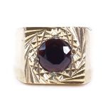 A large 9ct gold garnet signet ring, setting height 13.7mm, size P, 8.4g