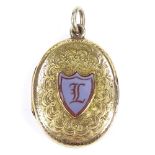 A Victorian 9ct gold locket pendant, with intaglio carved shield-shaped sardonyx seal, within a