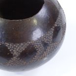 A Tribal black glaze terracotta bowl with incised frieze, height 17cm