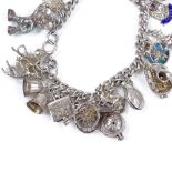 A silver charm bracelet, with various charms, 66.9g
