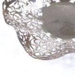 A silver fruit bowl, of frilled form with pierced scrollwork decoration, by Lancelott & Hall Ltd,