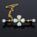 An Edwardian 15ct gold opal and diamond four-leaf clover bar brooch, set with heart and round