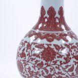 A Chinese white ground porcelain narrow-necked vase, with hand painted iron-red floral decoration,