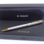 A Parker Sonnet ball pen, stainless steel/gold, new and boxed