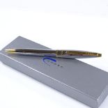 A Cross ball pen, highly polished chrome/gold, new and boxed