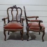 A pair of 19th century walnut-framed armchairs, with all over carved decoration
