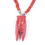 An Antique coral bug pendant necklace, with coral bead chain, pendant length 52.6mm, necklace length