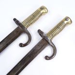 A pair of 19th century French sword bayonets, length 69cm