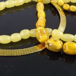 A gold plated collar necklace, lemon quartz bead necklace, and a graduated plastic bead necklace (3)