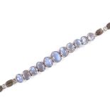 A 14ct gold graduate cabochon moonstone bracelet, largest length 7.8mm, bracelet length 17cm, 4.3g