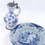 An 18th century blue and white Delft Pottery charger, with hand painted decoration, diameter 30cm,