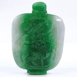 A Chinese relief carved jade snuff bottle and stopper, height 7cm