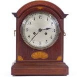 A mahogany dome-top mantel clock, circa 1900, with inlaid marquetry and stringing, engraved silvered