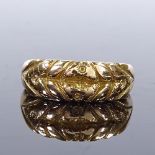 An 18ct gold band ring, with engraved floral decoration, maker's marks KBSP, band width 6.9mm,