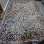 A large oriental silk rug, with exotic bird decoration