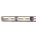 An Edwardian 15ct gold sapphire and pearl bar brooch, openwork settings with 3 square-cut sapphires,