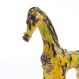 A Turkish yellow glaze Canakkale pottery horse, height 23cm