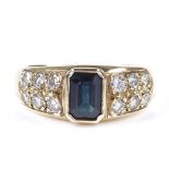 A 9ct gold sapphire and diamond dress ring, setting height 8mm, size O, 4.8g