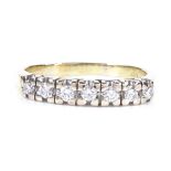 An 18ct gold 7-stone diamond half-hoop ring, total diamond content approx 0.3ct, setting height 6.