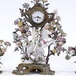 A 19th century French gilt-bronze and porcelain 3-piece clock garniture, surmounted by a figure on