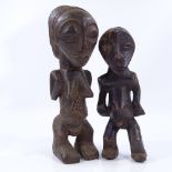 2 African Tribal carved wood fertility figures, largest height 31cm