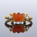 A Georgian unmarked gold carved coral and split-pearl double-heart ring, with milled shank,
