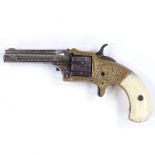 A 19th century XX Standard Revolver, brass and steel with ivory grips, by I J M Marlin of