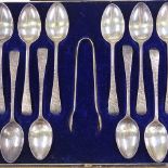 A cased set of Edwardian silver teaspoons, and a pair of sugar tongs, with engraved floral