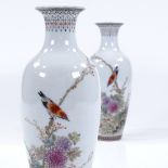 A pair of Chinese white glaze porcelain vases, with hand painted birds, flowers and text, height