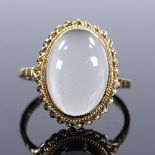 A 9ct gold cat's eye cabochon moonstone ring, with rope twist surround, setting height 17.6mm,