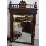 A 19th century French carved oak-framed wall mirror, with fluted columns, height 4'6", width 2'11"
