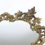 An ornate cast and pierced gilt-brass framed wall mirror, height 105cm (41")