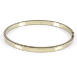 A German 8ct gold bangle, band width 4.7mm, internal diameter 66mm, internal height 59mm, 8.3g