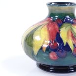 A Moorcroft Leaf and Berry pattern squat vase, height 10.5cm