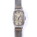 An Art Deco lady's platinum and diamond cocktail wristwatch, by Goldsmiths and Silversmiths Co