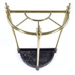A Victorian brass semi-circular stick stand, on painted metal base